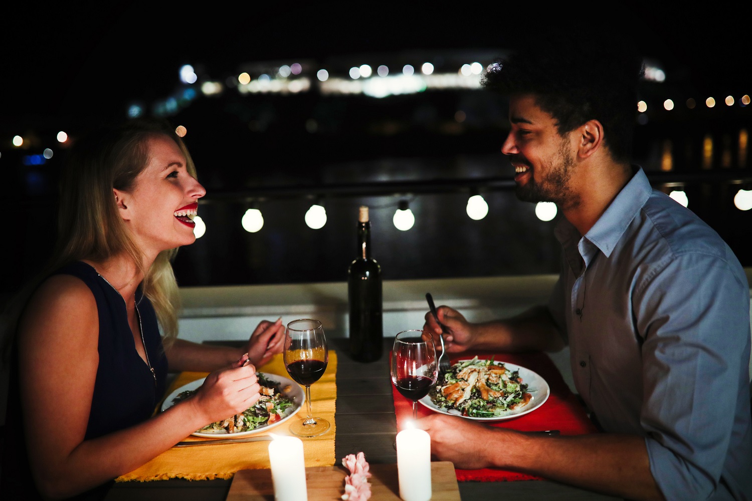 Couple having dinner at Baytowne Wharf Your Friend at the Beach