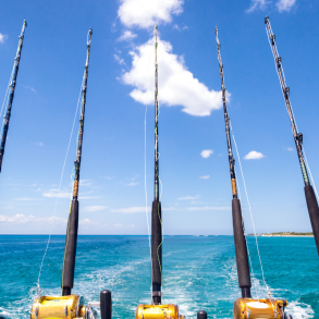 fishing rods attached to a deep sea fishing boat in Destin FL