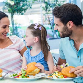 young family enjoying lunch together at one of the best Destin restaurants
