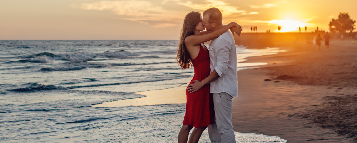 couple kissing on the beach