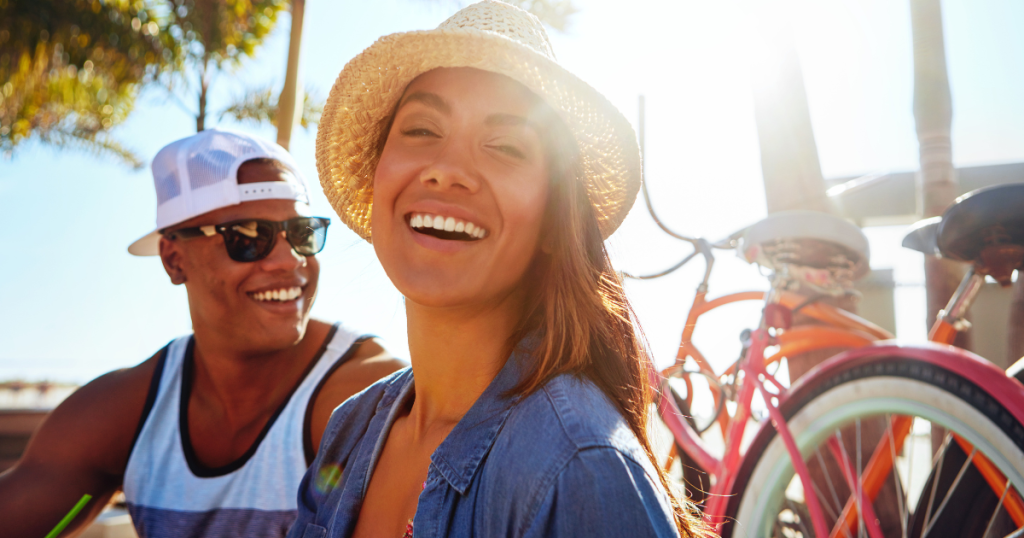 happy couple taking a break on bike ride