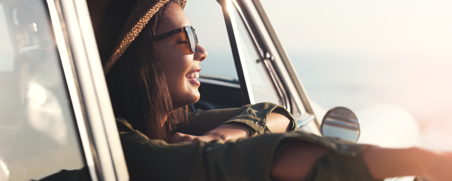 woman enjoying view from car